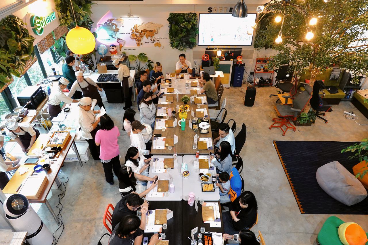 Softever team sharing a meal at Dinner Talk — Better You